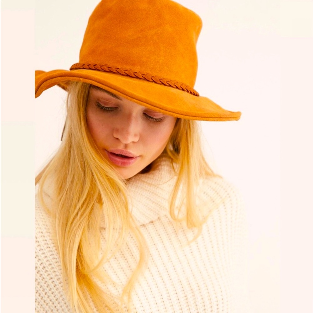 The classic bucket hat gets an update in allover suede with a braided band